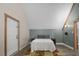 A cozy bedroom showcasing an interesting ceiling and warm natural light at 3636-A Holly Grove Rd, Dunn, NC 28334