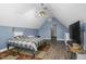 Bedroom with blue walls, a ceiling fan, and wood floors at 3636-A Holly Grove Rd, Dunn, NC 28334