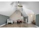 Large bedroom boasts vaulted ceilings and neutral paint, offering a versatile space at 3636-A Holly Grove Rd, Dunn, NC 28334
