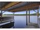 Interior view of a boat house on the water, offering a shaded space for boat storage and maintenance at 3636-A Holly Grove Rd, Dunn, NC 28334