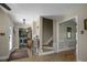 Inviting foyer with laundry area, staircase, and doorways leading to other rooms, creating a seamless flow at 3636-A Holly Grove Rd, Dunn, NC 28334