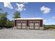 Spacious detached garage with dual doors, ideal for storage and workshop space at 3636-A Holly Grove Rd, Dunn, NC 28334