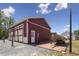 Versatile garage with an attached shed, equipped with a full-size door and a separate entrance at 3636-A Holly Grove Rd, Dunn, NC 28334
