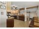 Spacious kitchen featuring two-tone cabinetry, stainless appliances, and an eat-in counter at 3636-A Holly Grove Rd, Dunn, NC 28334