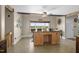 Open kitchen with a center island, ceiling fan and a view of the outdoors at 3636-A Holly Grove Rd, Dunn, NC 28334