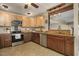 Updated kitchen featuring custom cabinetry, stainless steel appliances, and granite countertops at 3636-A Holly Grove Rd, Dunn, NC 28334