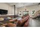 Comfortable living area boasts a wood burning stove, stairs to upper level, and access to screened-in porch at 3636-A Holly Grove Rd, Dunn, NC 28334