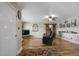 Open living room showcasing hardwood floors, comfortable seating, and a barn door leading to another room at 3636-A Holly Grove Rd, Dunn, NC 28334