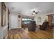 Inviting living room with hardwood floors, comfortable seating, and a scenic lake view from a large window at 3636-A Holly Grove Rd, Dunn, NC 28334