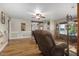 Open living room with hardwood floors, natural light, and relaxing seating arrangement at 3636-A Holly Grove Rd, Dunn, NC 28334