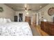 Spacious main bedroom with hardwood floors, a comfortable bed, and ample storage space at 3636-A Holly Grove Rd, Dunn, NC 28334