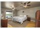 Serene main bedroom with a lake view, comfortable bed, and classic furnishings for a relaxing retreat at 3636-A Holly Grove Rd, Dunn, NC 28334