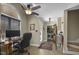 Comfortable home office space with natural light, ceiling fan, and view of laundry room at 3636-A Holly Grove Rd, Dunn, NC 28334