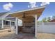 Charming covered outdoor kitchen featuring a grill and prep area for backyard entertaining at 3636-A Holly Grove Rd, Dunn, NC 28334