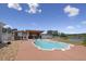 A luxurious pool area featuring an outdoor bar and lake views, perfect for relaxation and entertaining guests at 3636-A Holly Grove Rd, Dunn, NC 28334