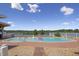 Scenic pool with lake view, bordered by a white fence, offering a tranquil retreat with privacy and natural beauty at 3636-A Holly Grove Rd, Dunn, NC 28334