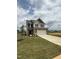Charming two-story home with stone facade, two-car garage, and inviting curb appeal at 364 Peach Grove Way, Lillington, NC 27546