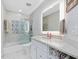 Modern bathroom featuring stylish tilework, a glass-enclosed shower, and a sleek vanity at 4001 Campbell Rd, Raleigh, NC 27606