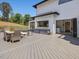Outdoor patio featuring cooking, dining, and living area with a view to landscaped yard at 4001 Campbell Rd, Raleigh, NC 27606