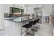 A kitchen featuring a large island with seating and stainless steel appliances at 4001 Campbell Rd, Raleigh, NC 27606