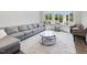 Cozy living room with a comfortable sofa, stylish coffee tables, and a bright window seat for relaxation at 4001 Campbell Rd, Raleigh, NC 27606