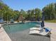 Inviting backyard pool with lounge chairs and lush surroundings for ultimate relaxation at 4001 Campbell Rd, Raleigh, NC 27606