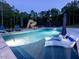 Lush pool with a slide and lounge seating at 4001 Campbell Rd, Raleigh, NC 27606