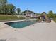 Backyard pool with slide and lounge area, perfect for Gathering fun and relaxation at 4001 Campbell Rd, Raleigh, NC 27606