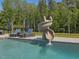 Inviting pool with a slide and lounge chairs, perfect for relaxation and entertainment at 4001 Campbell Rd, Raleigh, NC 27606