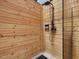 Outdoor pool house shower with wood paneled walls at 4001 Campbell Rd, Raleigh, NC 27606