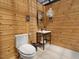 Pool house bathroom features toilet, sink, and ventilation at 4001 Campbell Rd, Raleigh, NC 27606