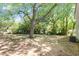 Spacious backyard featuring mature trees and a blend of sunny and shaded areas at 4204 Green Rd, Raleigh, NC 27604