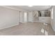 Large, open basement featuring laminate flooring and access to staircase and bathroom at 4204 Green Rd, Raleigh, NC 27604