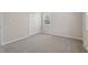 This bedroom has neutral carpet, a closet, a window, and neutral wall paint at 4204 Green Rd, Raleigh, NC 27604