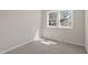 Bedroom featuring carpet, two large windows, and neutral wall paint at 4204 Green Rd, Raleigh, NC 27604