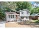 Charming two-story home with a red front door and a well-manicured front yard at 4204 Green Rd, Raleigh, NC 27604