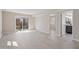 Spacious living room featuring wood-look floors and a sliding glass door to the backyard at 4204 Green Rd, Raleigh, NC 27604