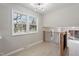 The upstairs landing features a large window, railing, and laminate floors at 4204 Green Rd, Raleigh, NC 27604