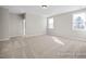 Spacious bedroom with neutral walls, carpet flooring, and natural light from the windows at 436 Golden Dragonfly St, Wake Forest, NC 27587