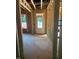 Entryway of a new home under construction, featuring a white front door and window views at 436 Golden Dragonfly St, Wake Forest, NC 27587