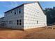 The exterior of a new home under construction displays house wrap and window placement at 436 Golden Dragonfly St, Wake Forest, NC 27587