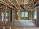 Partially framed living area showcasing layout, window placement, and structural elements in a new home at 436 Golden Dragonfly St, Wake Forest, NC 27587