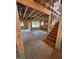 Spacious living room under construction with staircase, visible wood framing, and ample natural light at 436 Golden Dragonfly St, Wake Forest, NC 27587