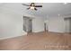 Open living space with wood floors, staircase and multiple entryways for entertaining or flexible floorplan at 436 Golden Dragonfly St, Wake Forest, NC 27587