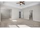Spacious main bedroom featuring a tray ceiling, ceiling fan, neutral walls and carpet flooring at 436 Golden Dragonfly St, Wake Forest, NC 27587