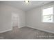 Bedroom with neutral walls, carpet, ceiling light, and closet for optimal storage at 440 Golden Dragonfly St, Wake Forest, NC 27587
