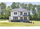 Charming two-story home featuring stone accents, inviting porch, and a well-manicured lawn at 440 Golden Dragonfly St, Wake Forest, NC 27587