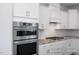 Modern kitchen showcasing stainless steel appliances, white cabinetry, and granite countertops at 440 Golden Dragonfly St, Wake Forest, NC 27587
