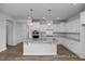 Spacious kitchen featuring granite countertops, stainless steel appliances, and a center island at 440 Golden Dragonfly St, Wake Forest, NC 27587