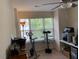 Bright bedroom with a ceiling fan, large window, and fitness equipment perfect for a home gym at 4910 Briarstone Ct, Raleigh, NC 27610